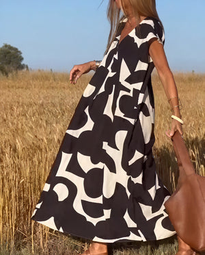 Fließendes Kleid mit abstraktem Muster